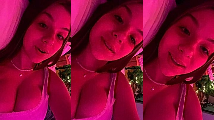 sexy naughty model Lynntoria lay on the bd with her big boobs upclose