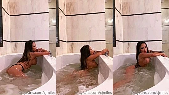naughty onlyfans model  CJ Miles takes a bath in the tub and rubs her tits