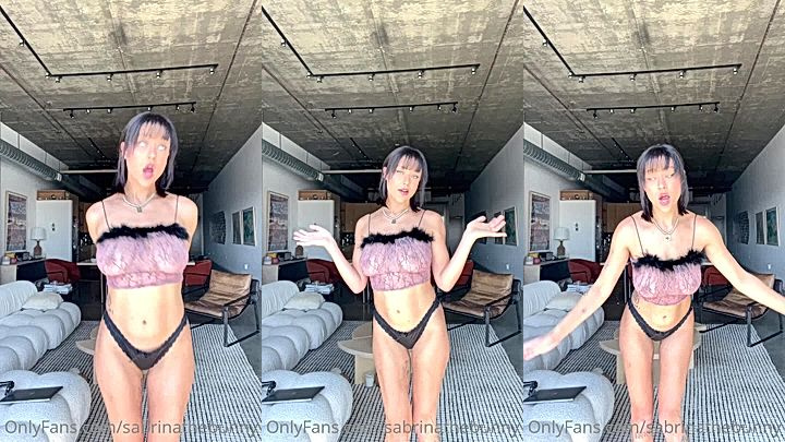 hot chick is undressing to show off her amazing boobs to her fans