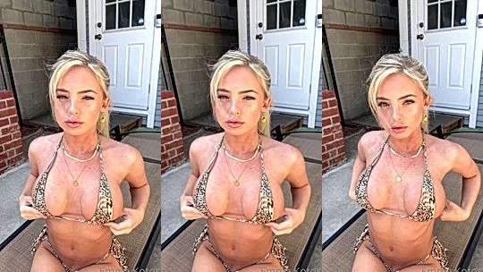 wild naughty bad bab Emma Kotos stares into the camera while she play with her sexy boobs